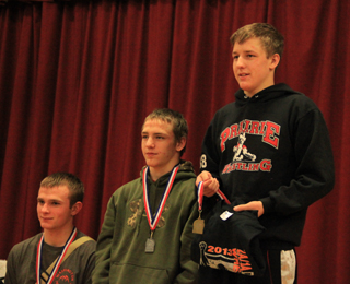 Alex Duman, right, took first place at 132 lbs., while Hunter McWilliams, center, took 2nd.