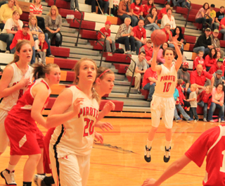 Leah Holthaus shoots a 3-pointer against Grace that helped to break a Grace rally as Kendall Schumacher gets into rebounding position. At left is Tanna Schlader.