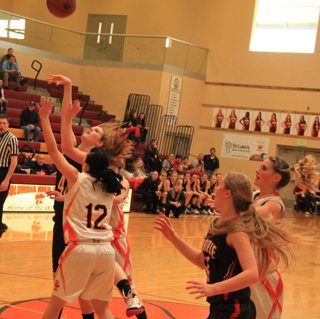 Tanna Schlader scores to break a Butte County run in the second quarter as Kayla Schumacher looks on.