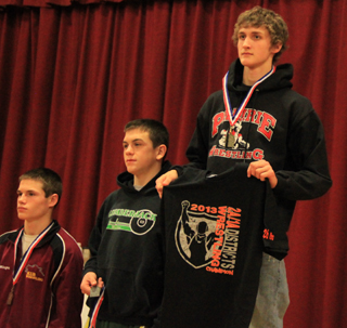 Tayler Heitman, right, took first place at 126 lbs.