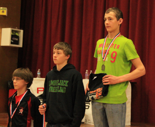 Tyler Ross, right, took first place at 113 lbs.