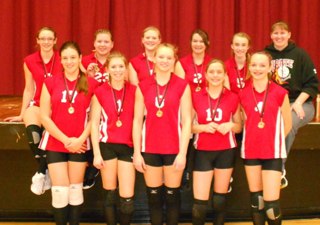 Katherine Nida is supported by Kirsten Latimer, Holli Uhlorn and Emily McHugh during a cheer at the Kamiah game.