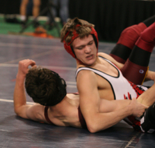 Dally Ratcliff is about to pin opening round opponent Sebastien Salazar of Challis.