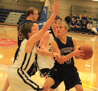 Shane Stubbers looks to shoot in Summits season-ending loss to Deary at District. In the back is Matthew Schwartz.