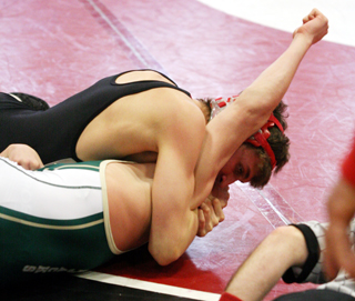 Tayler Heitman is about to score a pin in a consolation bracket match. State wrestling photos by Cheryl Gimmeson.