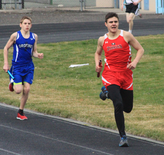 Gabe Angus runs the anchor leg of the medley relay. He teamed with Dakota Wilson, Victor Schmidt and Hunter McWilliams to place 3rd.