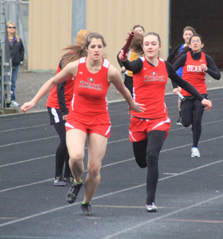 Krystin Uhlenkott hands off a lead to Shelby VonBargen for the final leg of the 4x200 relay. VonBargen was able to extend the lead as Prairie won easily. Keely Schmidt and Shayla VonBargen were the other members of the relay.