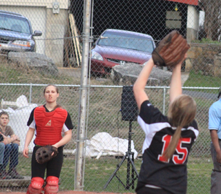 First baseman Kendall Schumacher settles under a popup as catcher Hailey Danly watches in the Orofino game.
