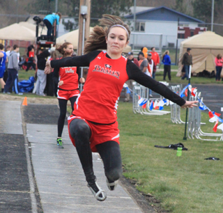 Krystin Uhlenkott flies towards the pit in the long jump where she placed second at 155.