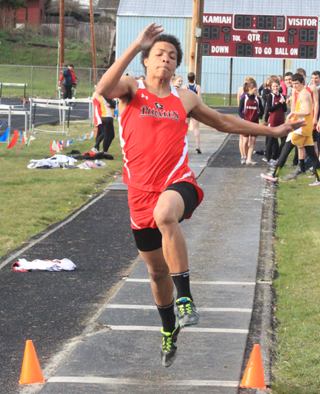 Tyler Hankerson takes flight in the long jump.