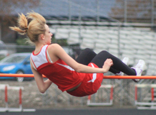 Brandi Gehring clears the high jump bar at the winning height of 46 at the Wildcat Invitational last Friday.