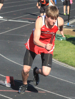 Isaiah Shears bursts out of the blocks at the start of the 4x200 relay at the Border War.
