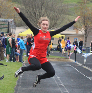 Krystin Uhlenkott takes flight in the long jump.
