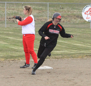 Taylor Nuxoll cuts second on her way to third with a triple against C.V.