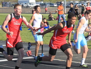 Jake Bruner hands off to Tyler Hankerson in the 4x200 relay.
