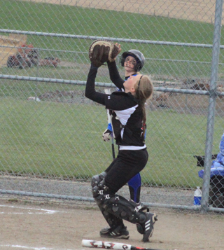 Sky Wilson goes after a foul pop-up against Orofino.