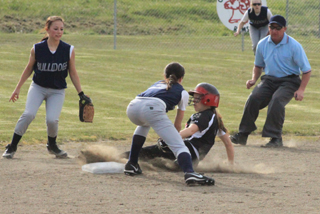 Sky Wilson managed to slide around the tag attempt for a stolen base against Genesee.