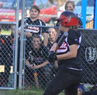 Kendall Schumacher hits the ball at Troy. Her 2-out, 2-run triple in the top of the 7th plated the tying and go-ahead runs in a 7-6 win.