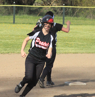 Mackenzie Rieman has a big smile as she rounds second on Kelsey Tidwells single to right.