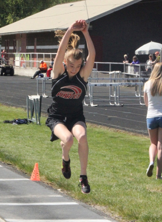 Kori Pentzer in the triple jump at the junior high meet at Kamiah.