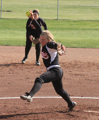 Sky Wilson winds up for a pitch in the Asotin game. Behind her is Tanna Schlader.