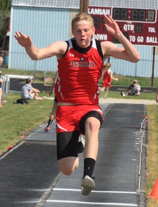 Jake Bruner is shown in the triple jump. He came up one spot short of qualifying for state in this event but did qualify in the long jump.