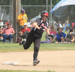 Kendall Schumacher heads for third with a triple in the first Greenleaf game. She wound up going 7 for 7 against Greenleaf's pitcher in the 2 games.