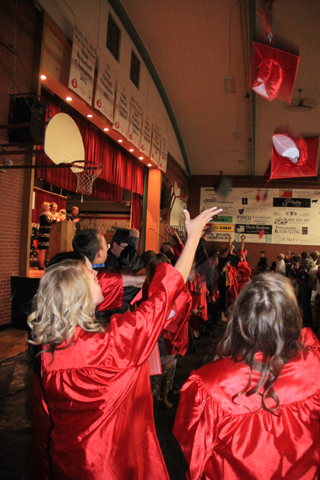 The hats fly after the ceremonies are over.