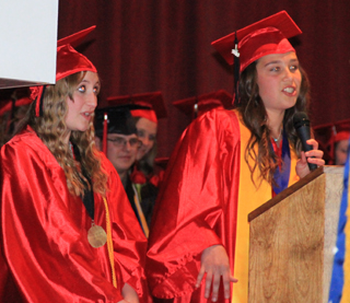 Co-Valedictorian Shaney Perrin, right, did her speech as a rap song with help from fellow grad Rachel Falzon.