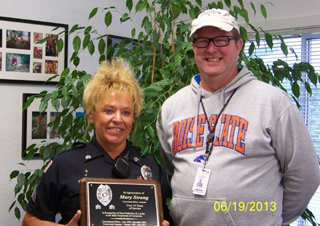 Mary Strang was honored recently on her retirement from NICI. She is shown with Warden Lynn Guyer. Photo provided by NICI.