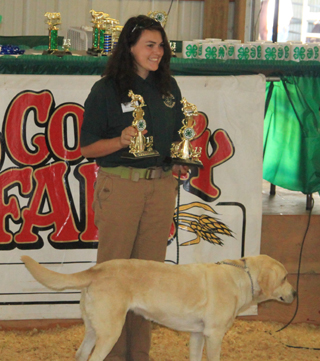 Kelly Turney of Whitebird took both grand champion trophies for the dog show. She received both the fitting and showing and dog obedience awards.
