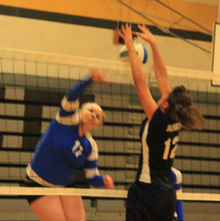 Megan Seubert blocks an Orofino spike during their Jamboree at Highland on Saturday.