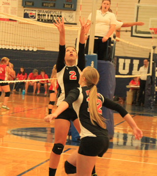 Natasha Gimmeson sets the ball for Kayla Schumacher during the Jamboree at Grangeville on Monday.