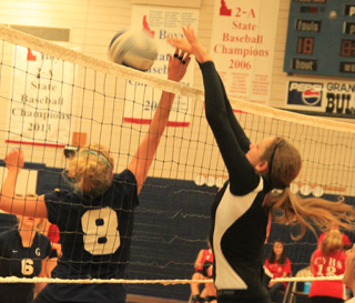 Shayla VonBargen blocks a Grangeville hitter during the Jamboree Monday.