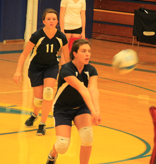 Megan Rehder makes a pass in Summits match at Nezperce as Kaitlyn Stubbers watches.