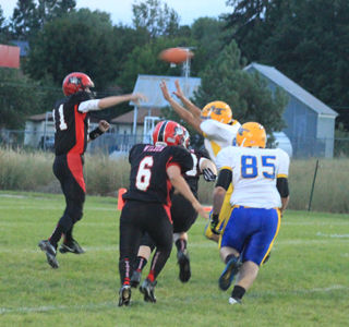 Jake Bruner gets a pass off early in the Salmon River game. #6 is Dakota Wilson.