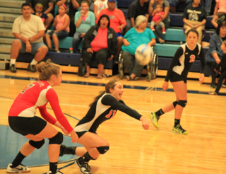 Krystin Uhlenkott makes a pass in serve receive at Lapwai. At left is Beka Bruner while at right is Natasha Gimmeson.