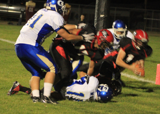 Lucas Arnzen comes down with a 2-point conversion after it had first defelcted off Rhett Schlader's hands.