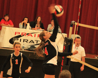 Krystin Uhlenkott tips the ball away from a Grangeville blocker. At left is Leah Holthaus.