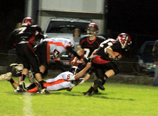Kendricks defender was grabbing anything he could to try to bring down Calvin Hinkelman. Also shown are Rhett Schlader, left, and Westin Crenshaw.