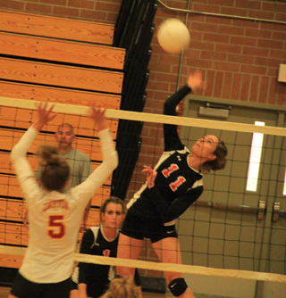 Krystin Uhlenkott goes for the kill against Dayton at the Border Battle. Also shown is Leah Holthaus. Uhlenkott was the Lewiston Tribunes Athlete of the Week last week.