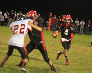 Isaiah Shears gains yardage after a catch while Lucas Arnzen blocks.