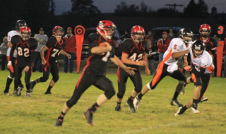 Lucas Arnzen breaks loose for the games first touchdown. Also shown from left are Casey Danly, Westin Crenshaw and Matt Schwartz.
