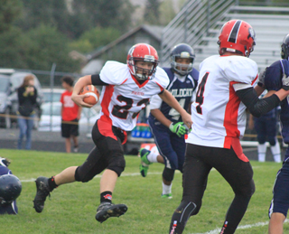 Calvin Hinkelman gained big yardage up the middle against Lapwai. At right is Isaiah Shears.