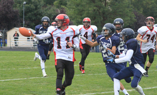 Jake Bruner pitches to Lucas Arnzen (not shown) who went 73 yards for a touchdown on this play. Also shown are Isaiah Shears, 4, and Westin Crenshaw, 74.