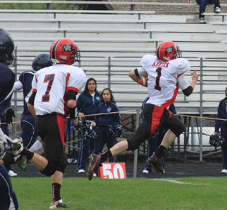 Prairie's 2nd offensive play of the game saw Lucas Arnzen race 76 yards for a touchdown. At left is Rhett Schlader.
