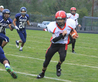 Mason Dalgliesh, normally a defensive player only, got to carry the ball on the final touchdown drive. In the back is Jake Bruner.