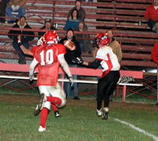 Rhett Schlader is about to catch a pass deep down the sideline. He eventually fumbled at the 1 on this play but got the ball right back for the Pirates with an interception on the next play.