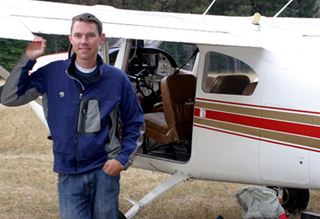 Richard Holm, Jr. with his Cessna 182 within the Selway Bitterroot Wilderness area. 