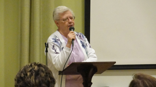 Sister Carol Ann Wassmuth introduces human rights activist and educator Tony Stewart.